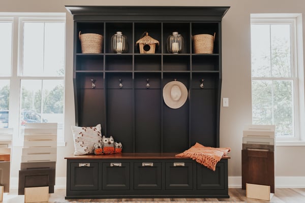 Built-in mudroom storage unit with decorative cubbies at Ridgewood Home Construction showroom in Grand Rapids, MI