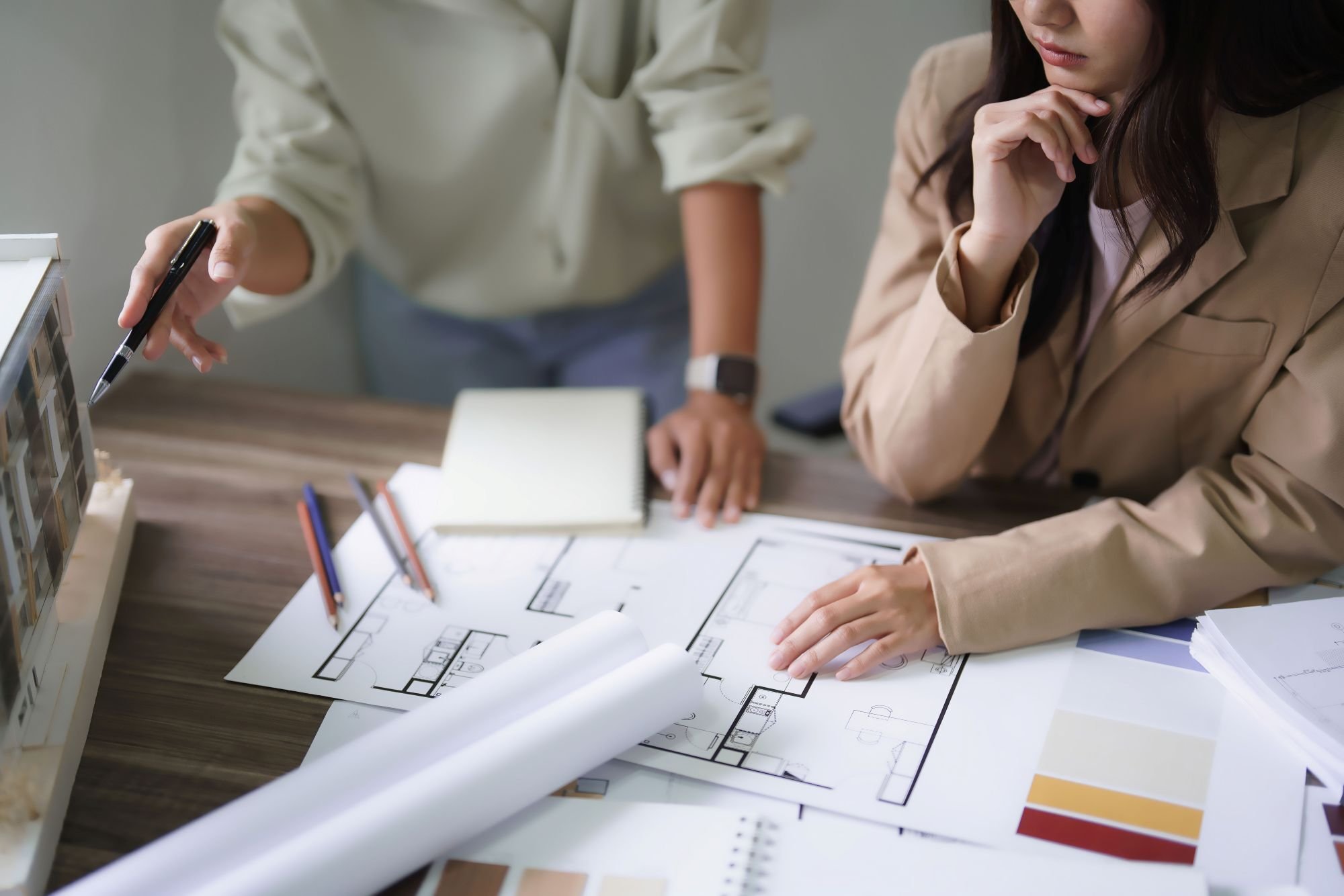 Stock Image of Two People Discussing Design Plans Stock Image of Two People Discussing Design Plans