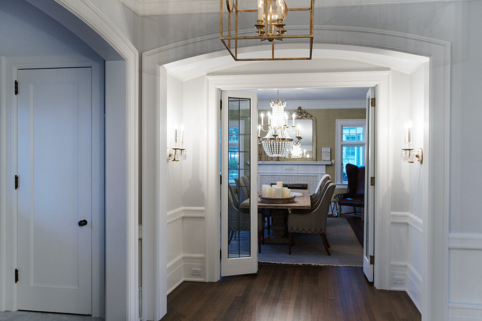 East Grand Rapids dining room renovation with chandelier and French doors by Ridgewood Home Construction