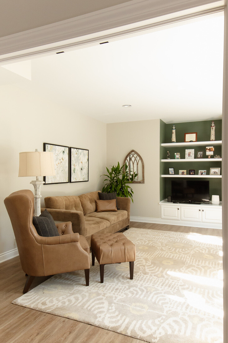Comfortable basement living area with built-in entertainment center in Grand Rapids Township by Ridgewood Home Construction