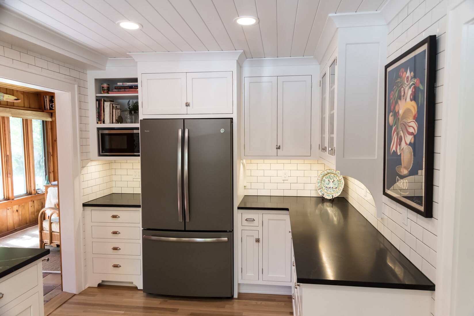 Bright white kitchen remodel with stainless steel appliances by Ridgewood Home Construction in Rockford, MI