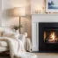 A cozy living room in West Michigan, with a lit fireplace, an armchair draped in white and beige blankets, a floor lamp, shelves with decor, and candles on the mantel, offers a warm refresh to your space.